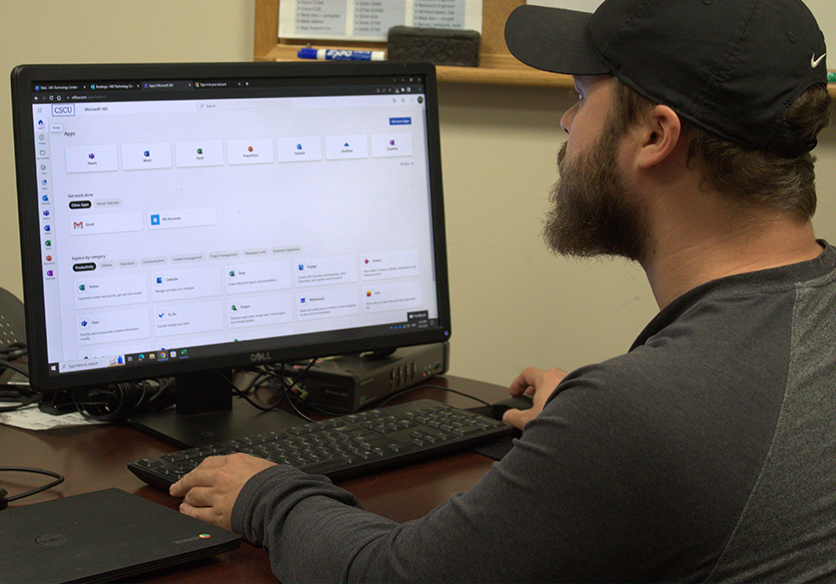 student looks at computer screen