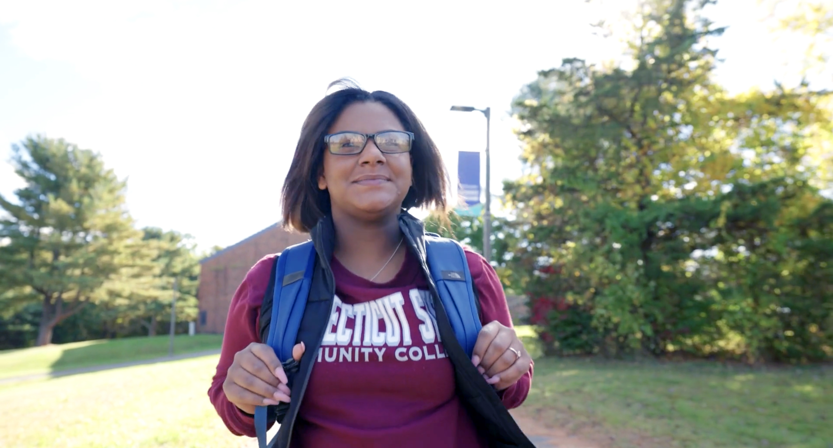 CT State student walks outside on campus